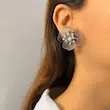 گوشواره نقره‌ای استیل طرح گل افشان فشن کد GO00220