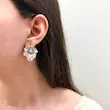 گوشواره نقره‌ای فشن طرح گلبرگ کوبیده‌شده کوچک کد GO00344