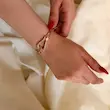 بنگل طلایی ژوپینگ امگا الماسه روی مچ دست
