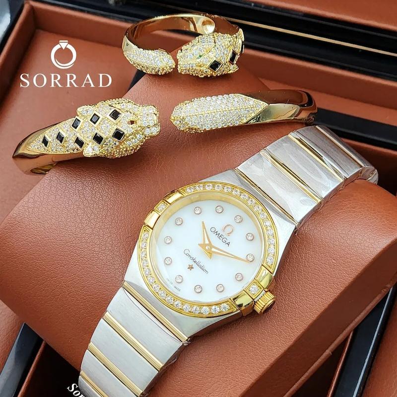 ساعت زنانه امگا / کانسلیشن بند استیل رنگ سیلور-طلایی صفحه دورنگین سفید-طلایی