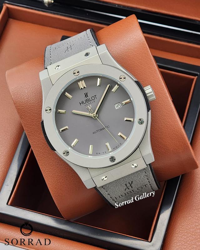 ساعت هابلوت مردانه / اتومات بند جیر رنگ طوسی صفحه طوسی-سیلور