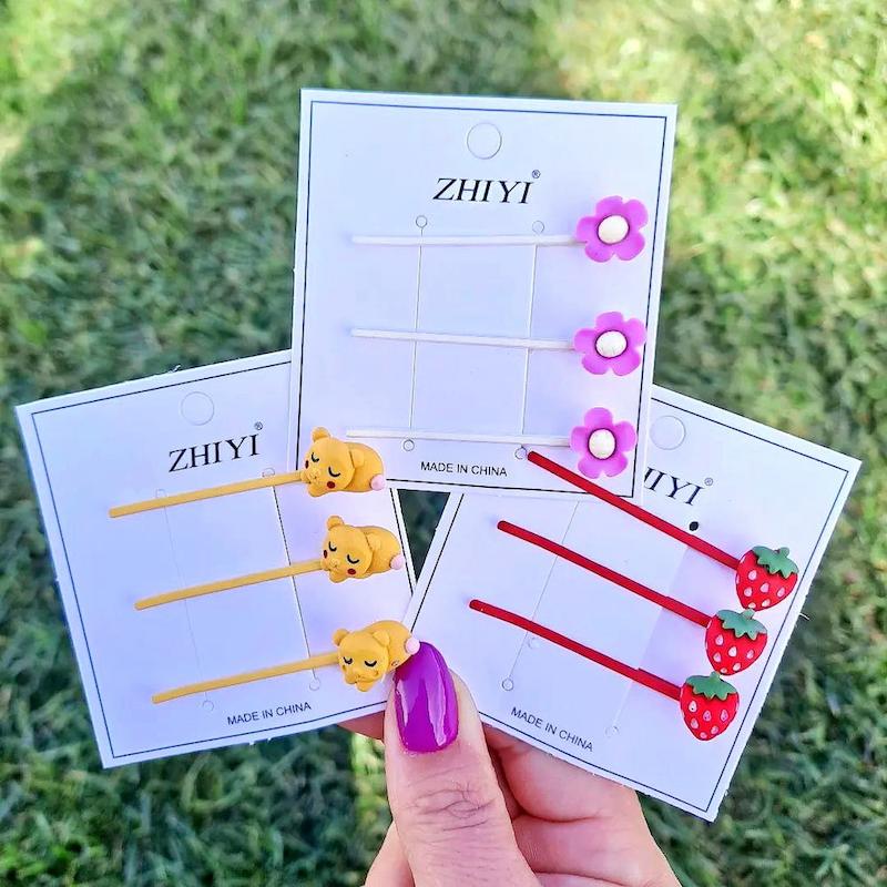 سنجاق سر فانتزی رنگی در پانزده پک متنوع کارتونی - سایت فروشگاهی گلسر سوما