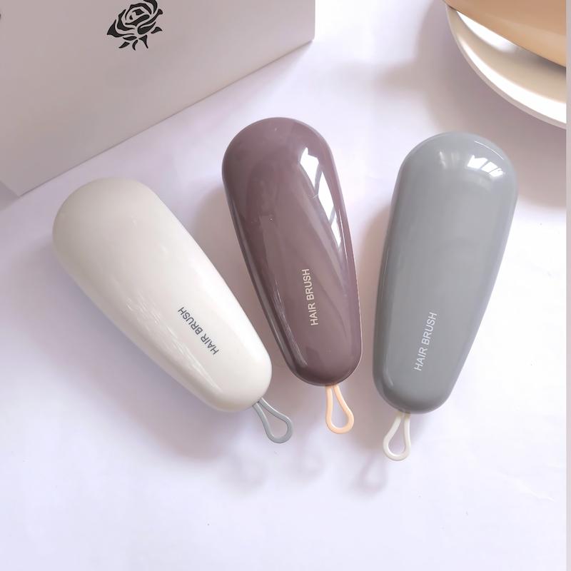 برس مو گره باز کن منعطف طرح حلزونی در رنگهای سفید، بنفش، طوسی و کرم - سایت فروشگاهی گلسر سوما