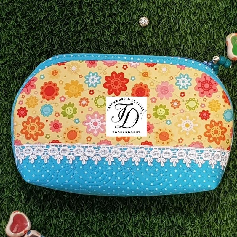کیف لوازم آرایش گلدار زرد و آبی