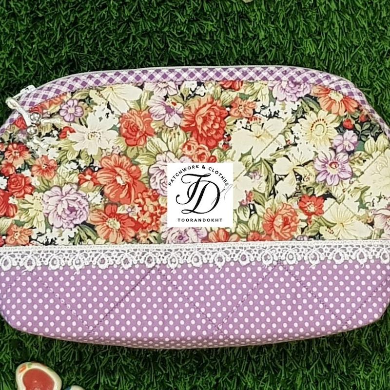 کیف لوازم آرایش گلدار سرخ و بنفش