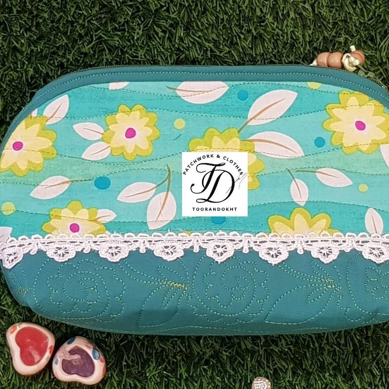 کیف لوازم آرایش گلدار سبزآبی