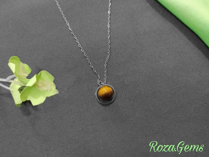 گردنبند استیل زحل چشم ببر