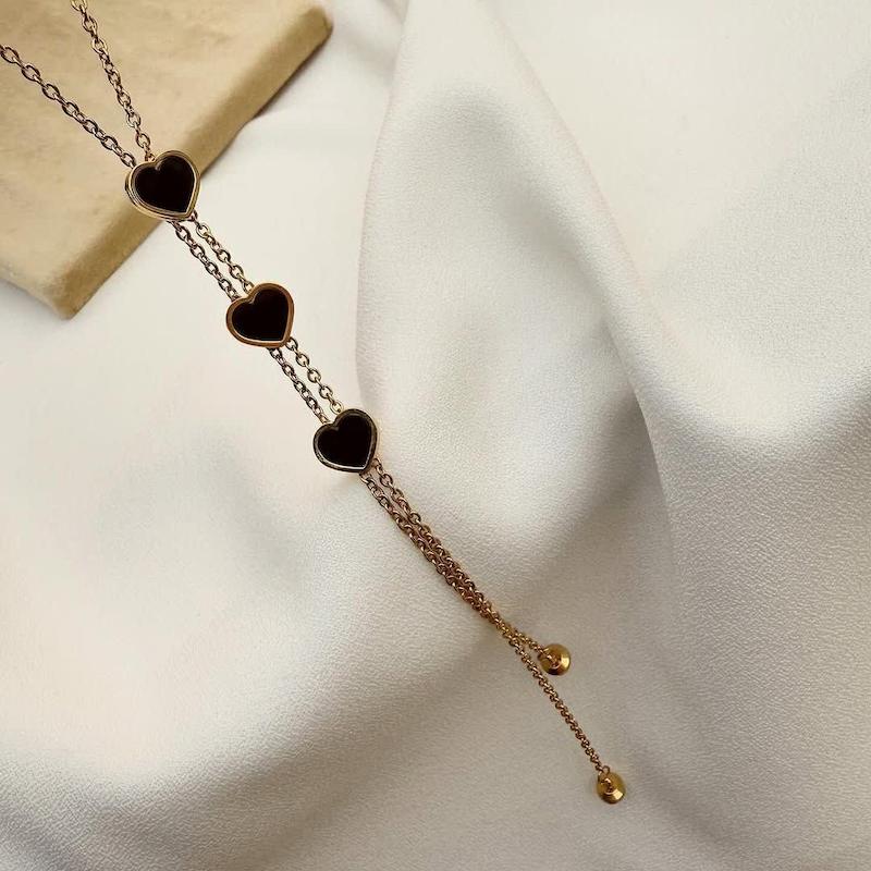 نیم ست قلب مشکی طلایی