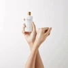 کرم ضد آفتاب رنگی اسکین 1004 SPF 50 مدل ایر فیت پلاس