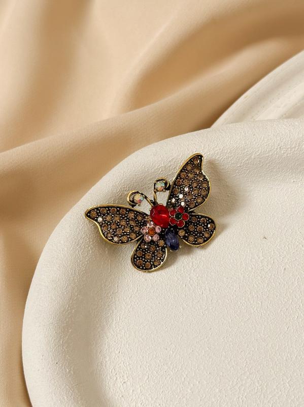 گل سینه زنانه پروانه شامپاینی